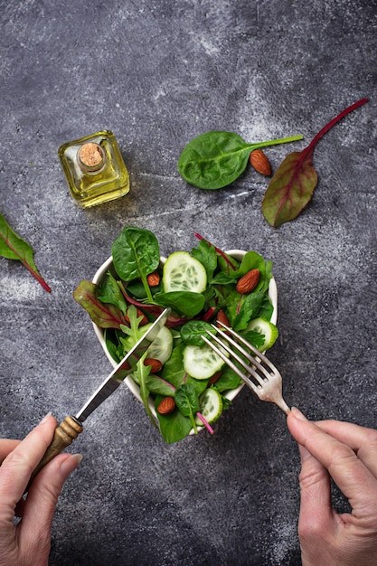 Salad mix with cucumber and almond. Healthy food concept. Selective focus