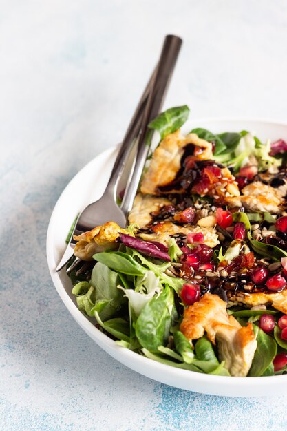 Salad mix with grilled chicken, seeds and citrus dressing