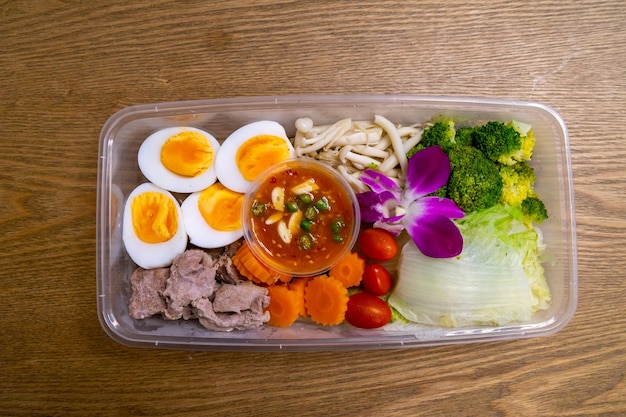 Salad in plastic box package delivery ready to eat
