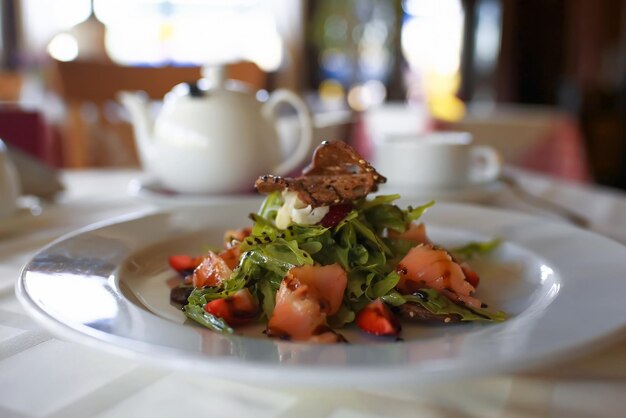 Salad in a plate on a table