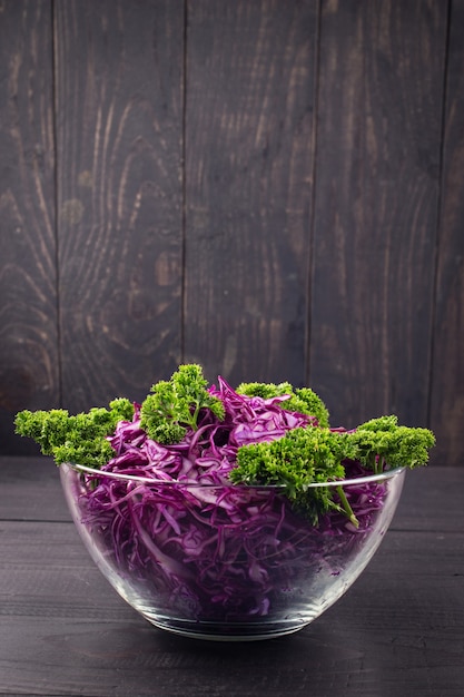 Salad of red cabbage in a plate and parsley