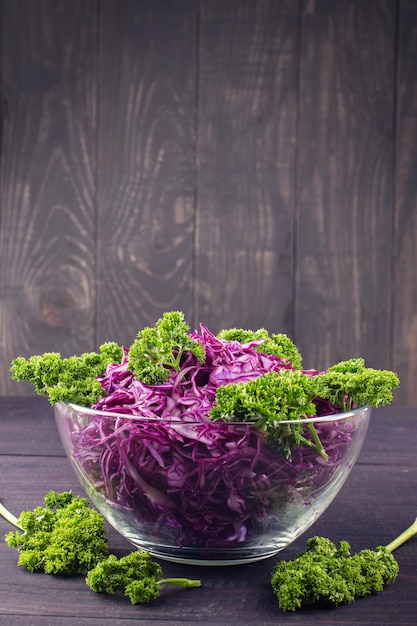 Salad of red cabbage in a plate and parsley