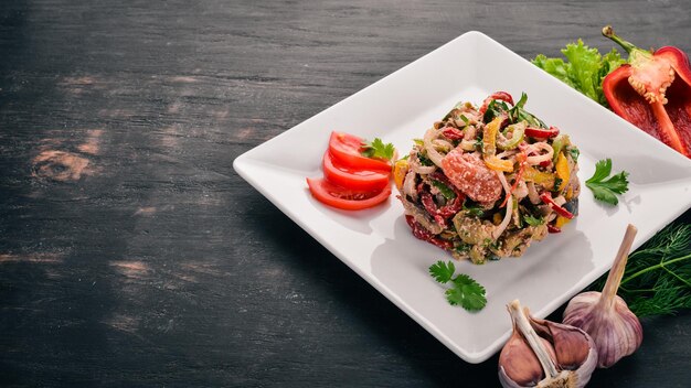 Salad of roasted vegetables Grilled vegetables On the old wooden background Free space for text Top view