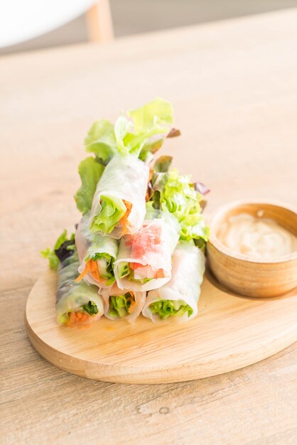 salad roll on wood plate