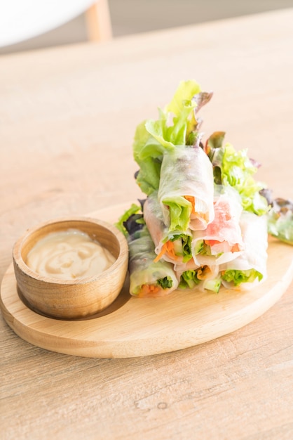 salad roll on wood plate