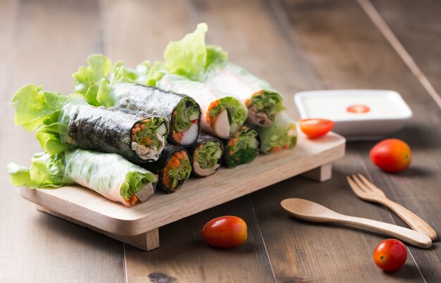 salad roll on wood plate