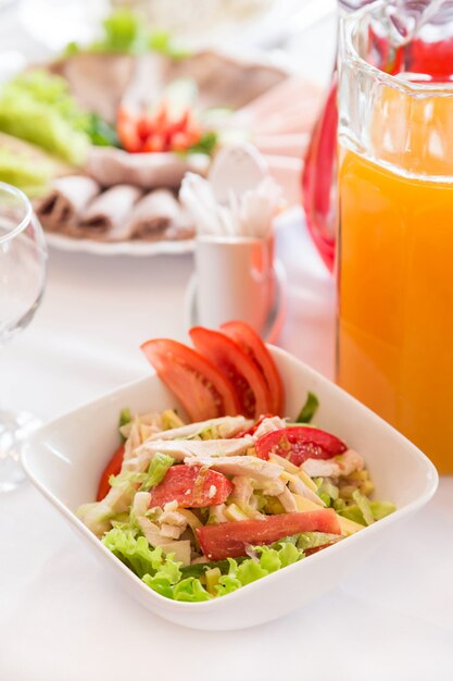 Salad and snack serve on table