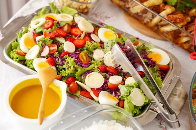 Salad tray with various fruits greens and cold vegetables