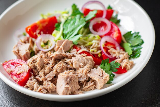 Salad tuna fresh seafood vegetable tomato olive canned tuna fish plate on the table healthy meal