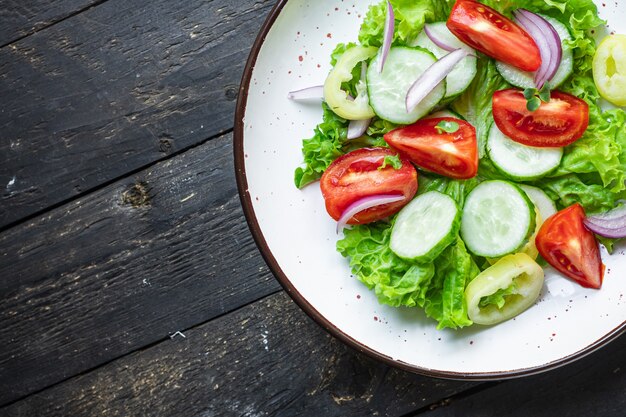 Salad vegetable tomato cucumber pepper onion lettuce meal snack copy space food background