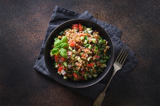 Salad of whole grain cereal spelt with seasonal vegetables