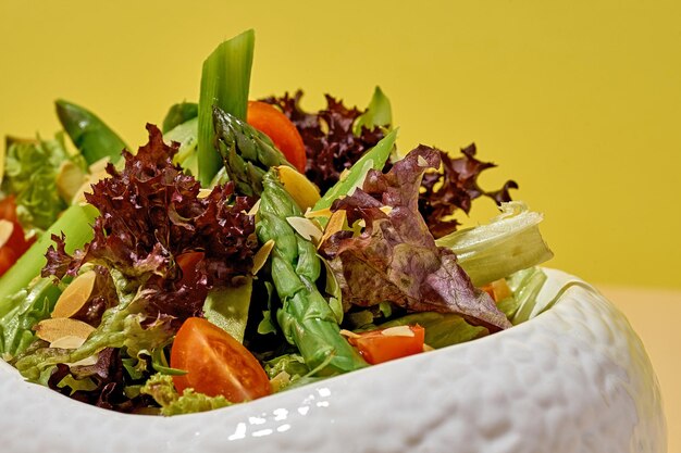 Salad with asparagus on a bright background