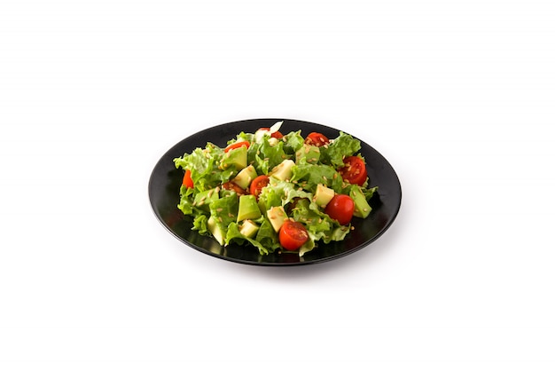 Photo salad with avocado, lettuce, tomato, flax seeds isolated on white background