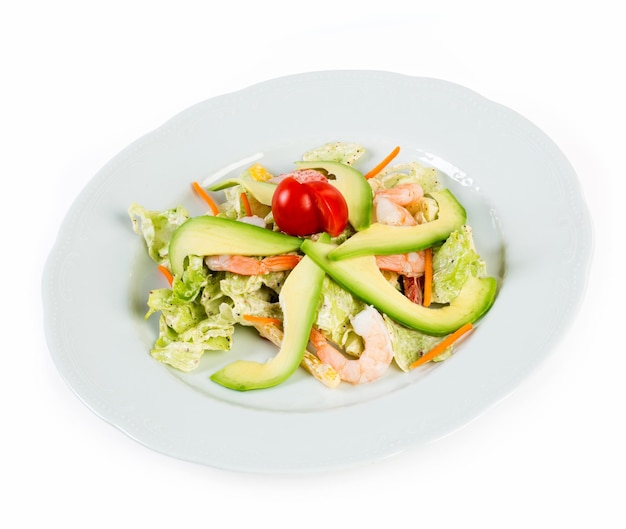 Salad with avocado and prawns on a white background