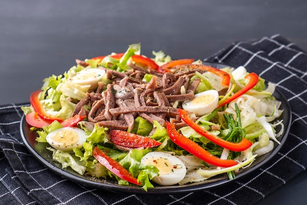 Salad with beef tongue and vegetables