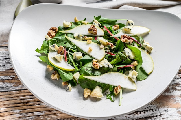 Salad with blue cheese, pears, nuts, chard and arugula 