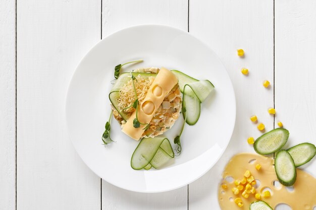 Salad with cheese cucumbers and corn with mayonnaise