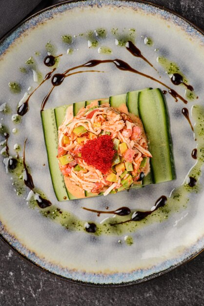 salad with crab meat, cucumber and tobiko