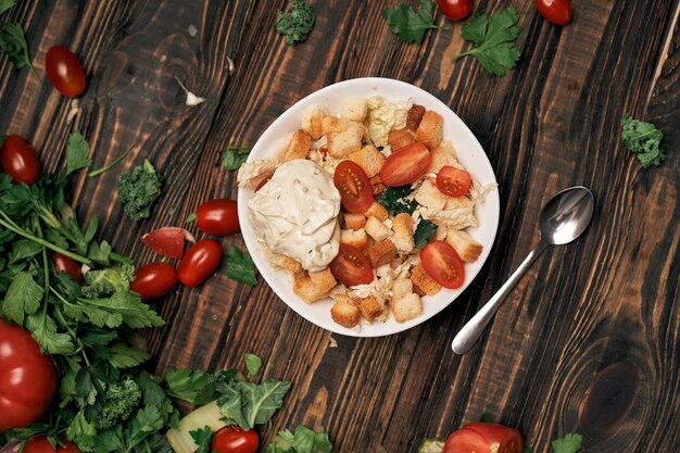 Salad with crackers on the kitchen table  photo with a copyspace