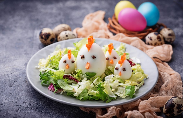 Salad with eggs in shape of chickens. festive food.