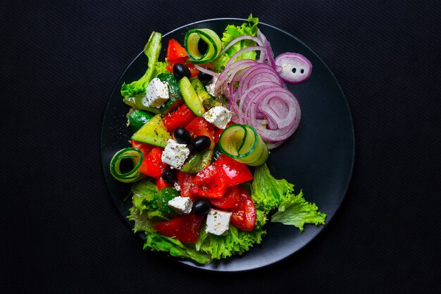 Salad with feta cheese, onion and tomatoes