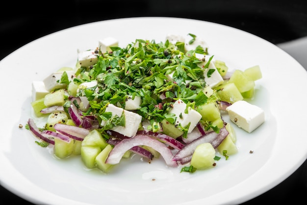 Salad with feta cheese, peppermint and cucumbers