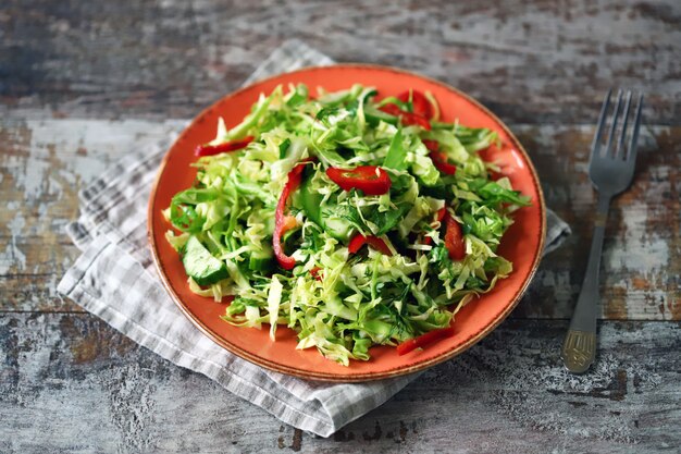 Photo salad with fresh cabbage, herbs and cucumber.