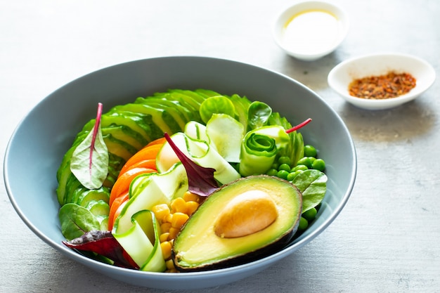 salad with fresh cucumber avocado and lettuce