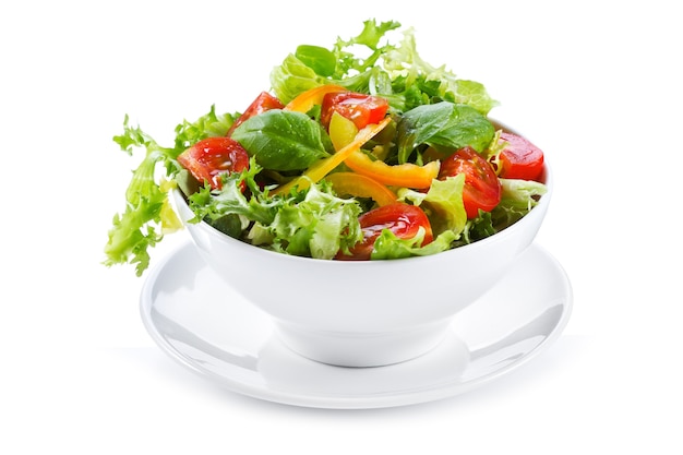 Salad with fresh vegetables and greens on white background