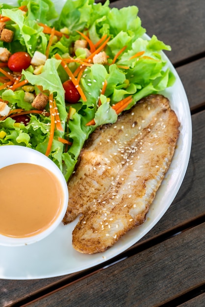 salad with fried fish fillet