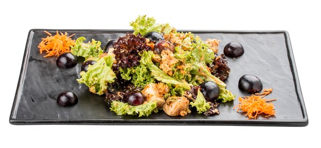 Salad with grilled chicken and grapes On a white background