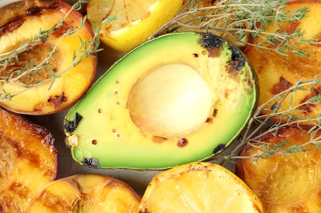 Salad with grilled peach all over background, close up