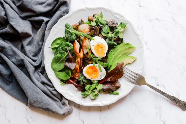 Salad with herbs and boiled egg