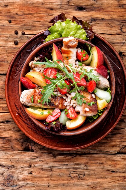 Salad with meat and strawberries