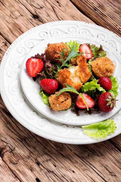 Salad with meat and strawberries