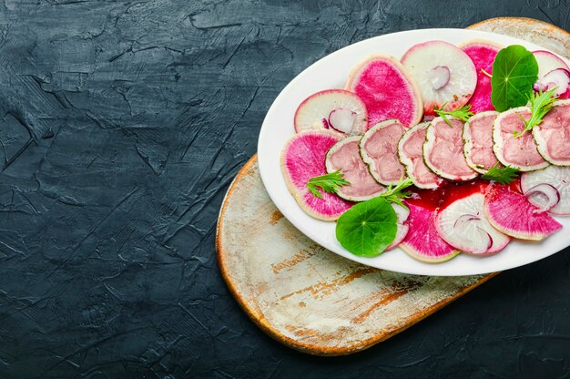 Salad with meat tongue and radish