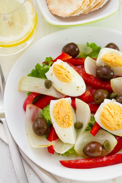 Salad with olives and boiled egg