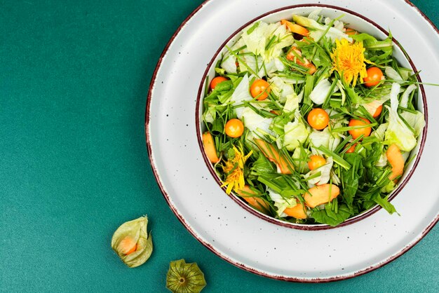 Photo salad with physalis and grass detox food