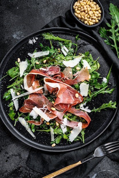 Salad with prosciutto ham and cheese