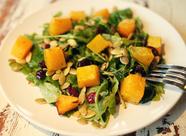 Salad with pumpkin pumpkin seeds and arugula