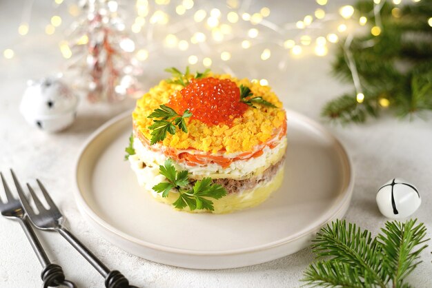 salad with red caviar canned fish potatoes cheese carrots and eggs