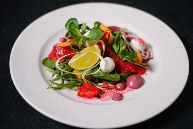 Salad with salmon beets lemon and herbs