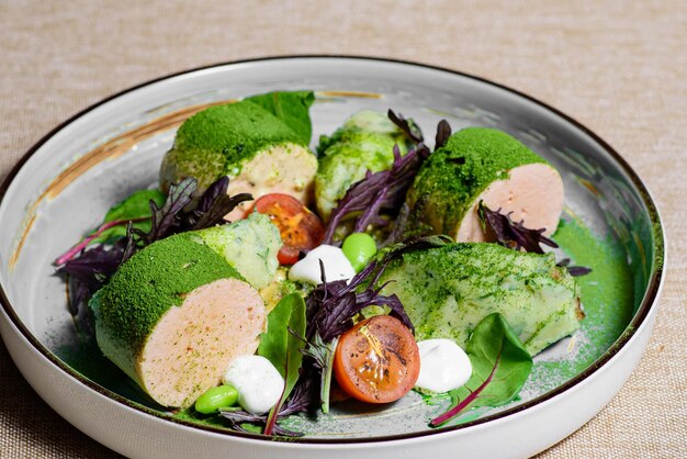 Salad with sausage tomatoes basil and lettuce