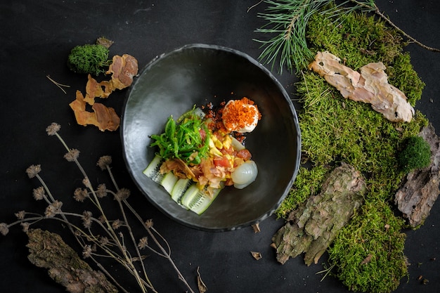 Salad with scallop wakame tuna flakes and avocado