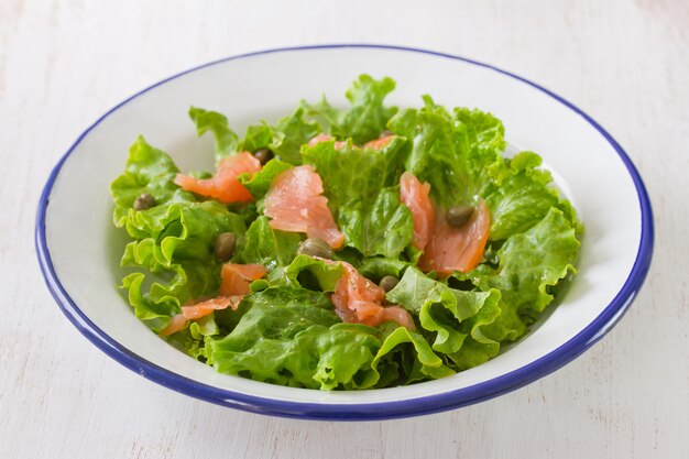 Salad with smoked salmon on plate