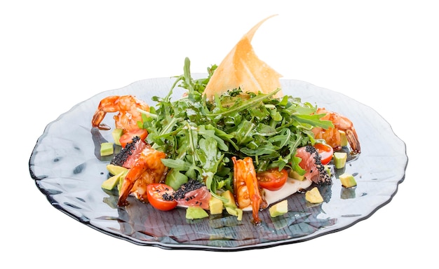 Salad with tiger shrimps arugula avocado and grapefruit under oyster sauce