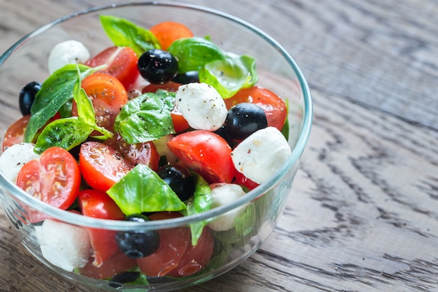 Salad with tomatoes, olives, mozzarella and basil