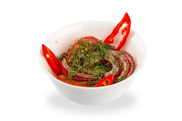 Salad with tomatoes sweet and hot peppers and onions On a white background