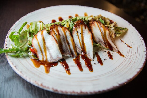 Salad with tuna and balsamic sauce. High quality photo