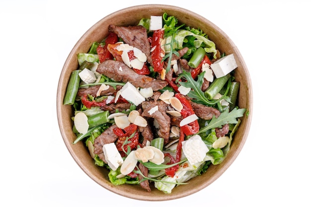 Salad with veal and tofu on a white background for a food delivery site 2